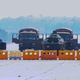 Military vehicles take position on a blockaded road near Myanmar’s Parliament in Naypyidaw on February 4, 2021.
